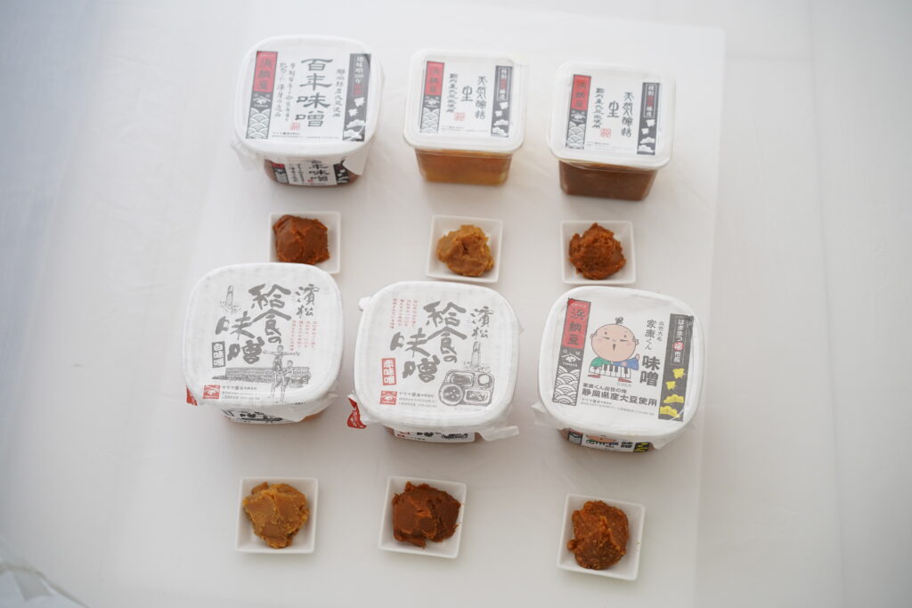 Traditional Japanese miso varieties displayed for tasting.
